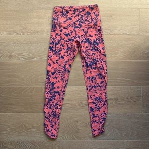 Lululemon coral and navy leggings.